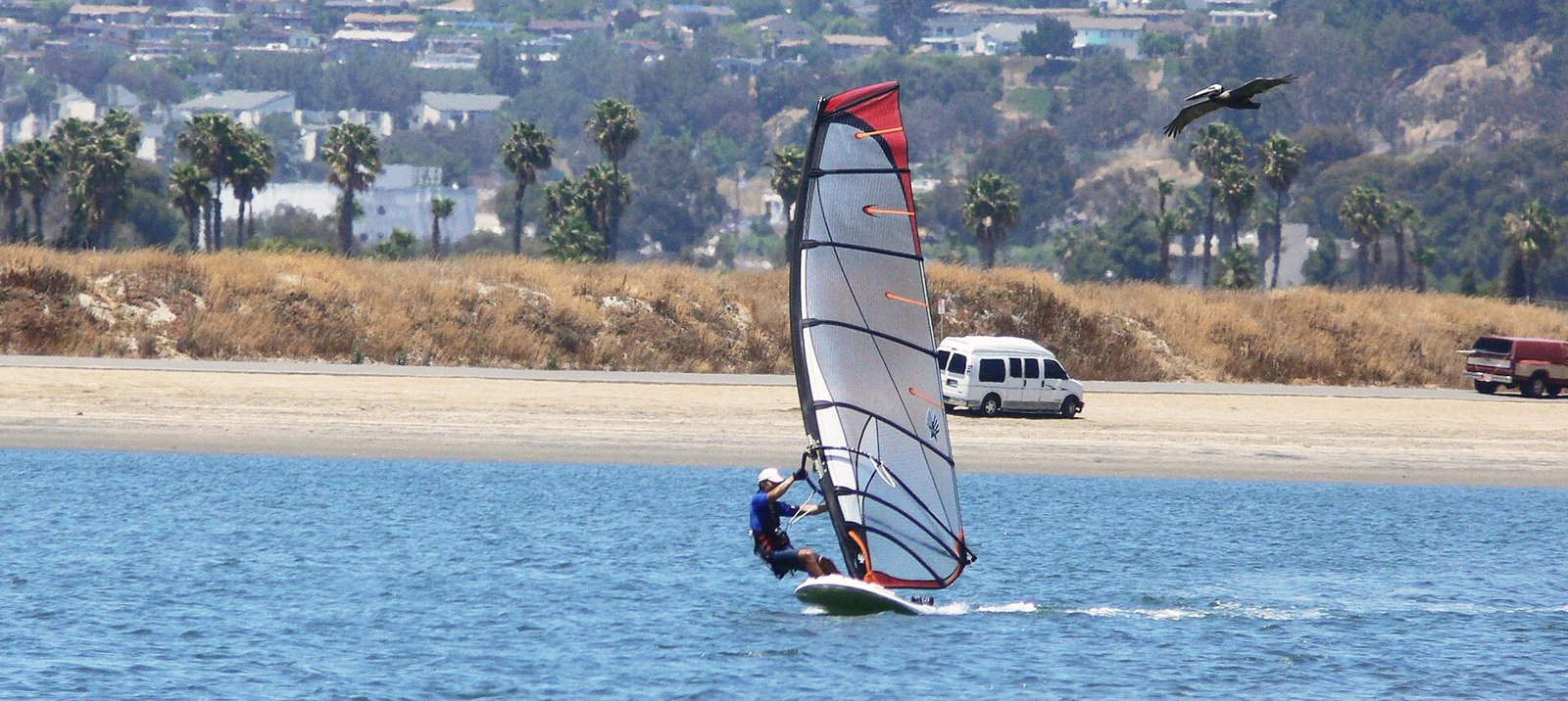 Windsurfer crossing Mission Bay, San Diego, in the afternoon sea breeze