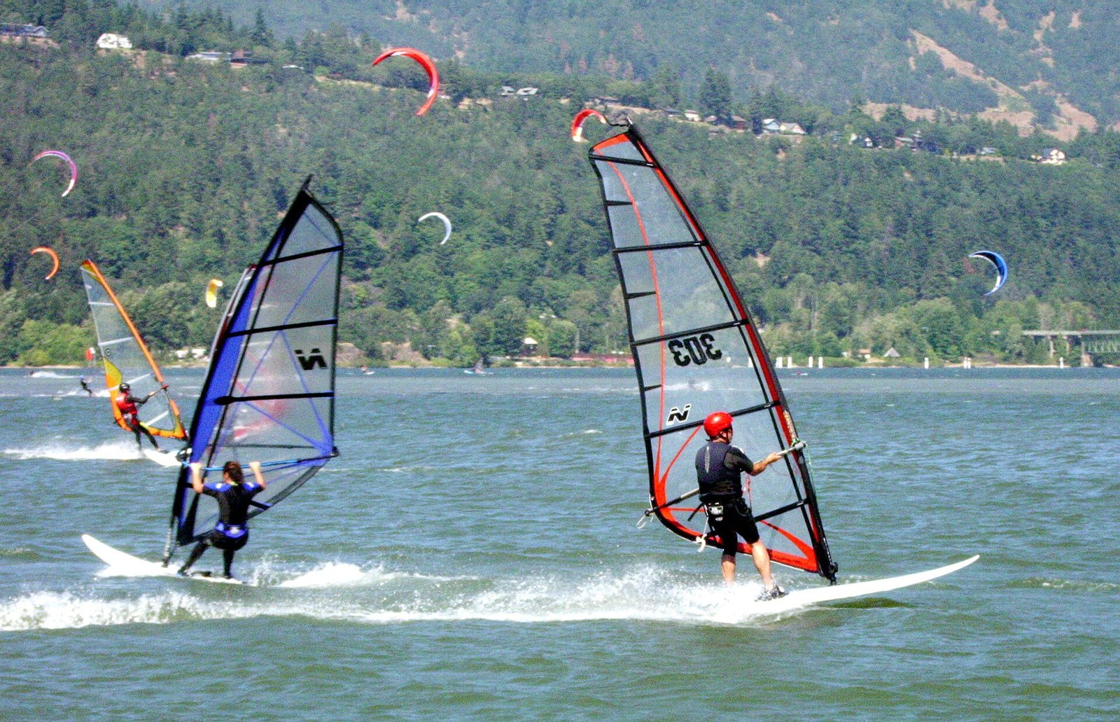 Windsurfers and kiteboarders on the Columbia River at Hood River, Oregon, on a windy summer day